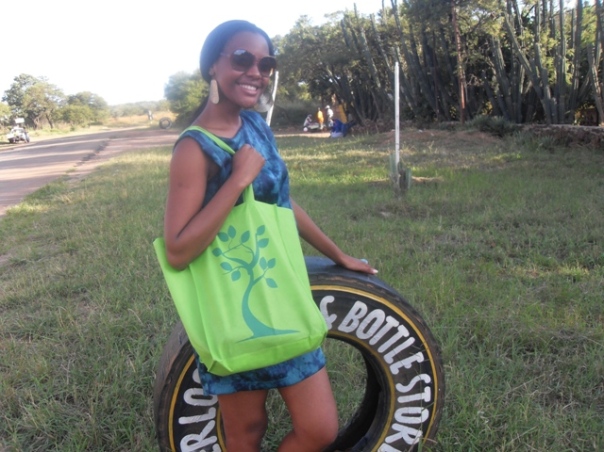 Thandi with a "reusable green bag"